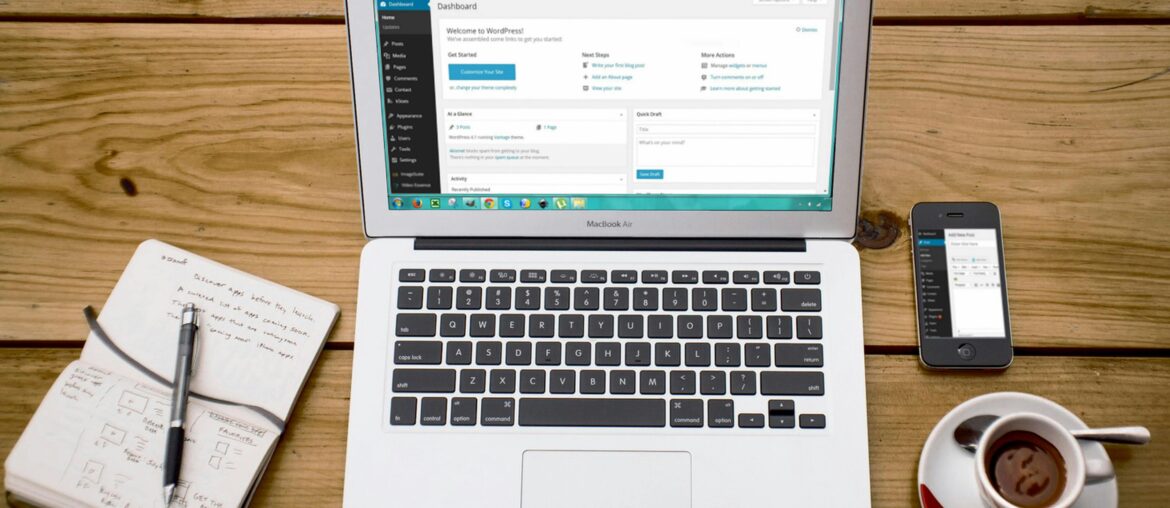 Open journal with handwritten notes and a tea cup — symbolizing personal reflection and the journey of blogging.